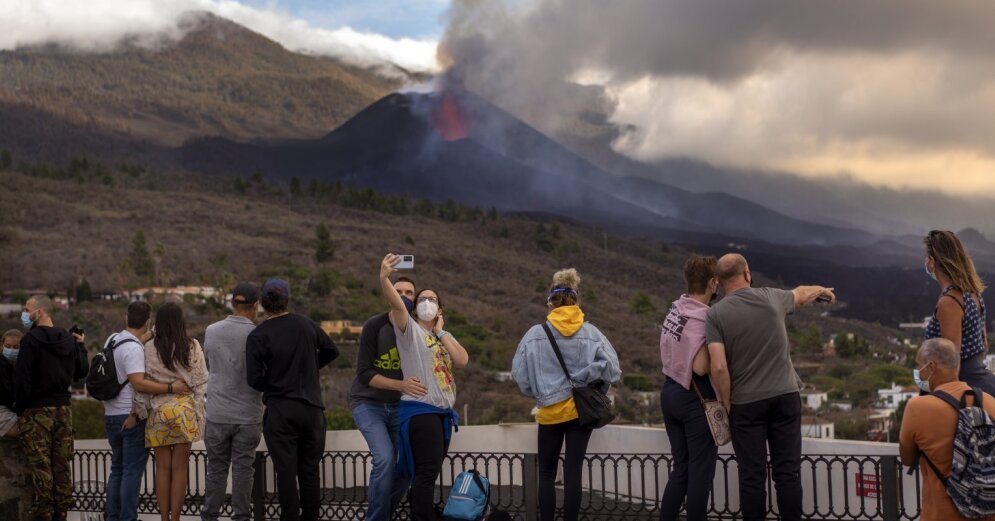 Tourists rush to see the volcanic eruption on La Palma Island